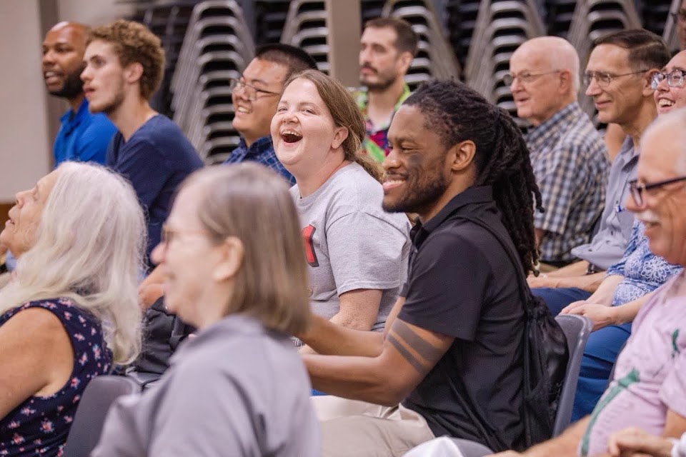 Campers laughing together during a session at the Bill Rice Ranch deaf adult camp